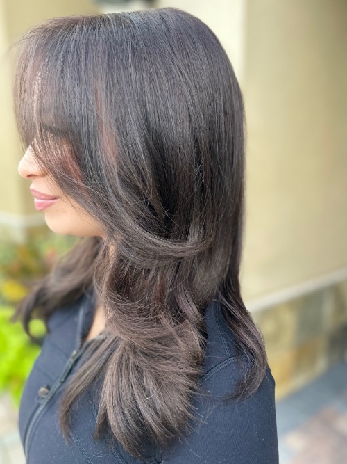 woman with red hair and glasses