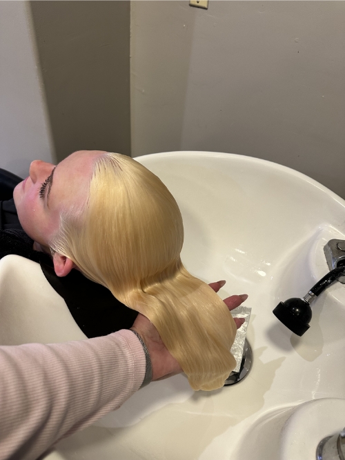 woman getting hair color in a salon